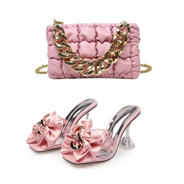 Luxury pink puffy handbag with gold chain strap and matching bow heels with clear heel