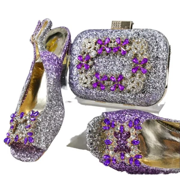 A stunning purple glitter shoe and clutch set adorned with sparkling purple and clear stones, perfect for formal occasions.