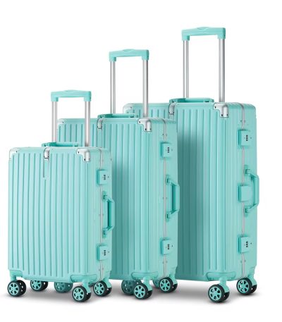 A set of three turquoise suitcases with telescopic handles and wheels, perfect for luxurious travel experiences.