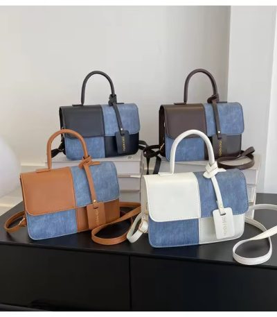 A collection of stylish denim patchwork handbags with leather accents in various colors, perfect for adding a touch of luxury to any outfit.