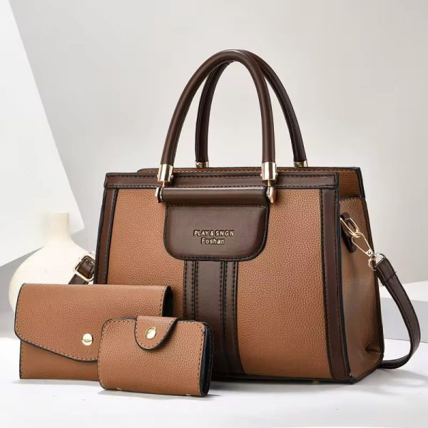 A luxurious 3-piece brown leather handbag set with gold accents, featuring a spacious handbag, clutch, and wallet.