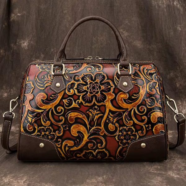 A luxurious brown leather handbag with intricate floral design, perfect for adding a touch of sophistication to any outfit.