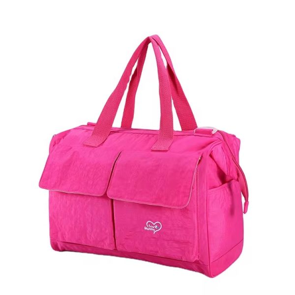 A pink insulated lunch bag with durable handles, perfect for work or school, keeping meals fresh and stylish.