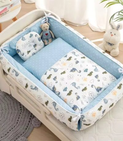 A baby bed with a cartoon animal print bedding set, complete with a comfortable crib liner and soft pillow, in a serene nursery setting.