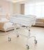 A luxurious baby bathtub stand with wheels and storage basket, perfect for comfortable and convenient bathing.