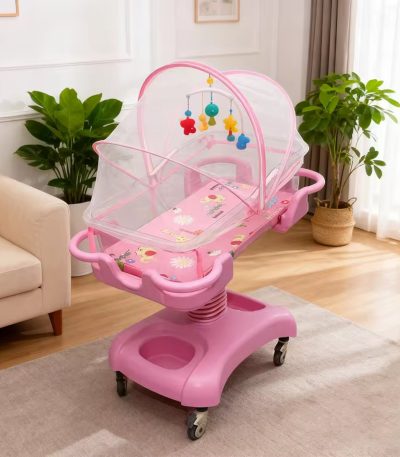 A pink baby crib with mosquito net and mobile in a cozy living room, perfect for a comfortable and safe sleeping space for your baby.