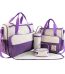 A beautifully arranged 5-piece diaper bag set in a luxurious polka dot and purple design, perfect for the stylish and quality-conscious parent.