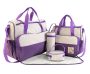 A beautifully arranged 5-piece diaper bag set in a luxurious polka dot and purple design, perfect for the stylish and quality-conscious parent.